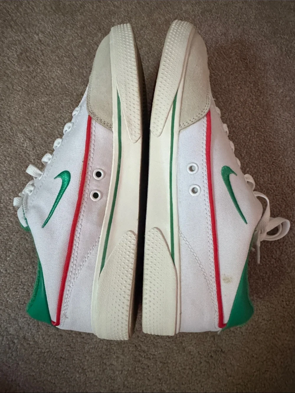 Nike White Sneakers with Green Swoosh and Red Stripe
